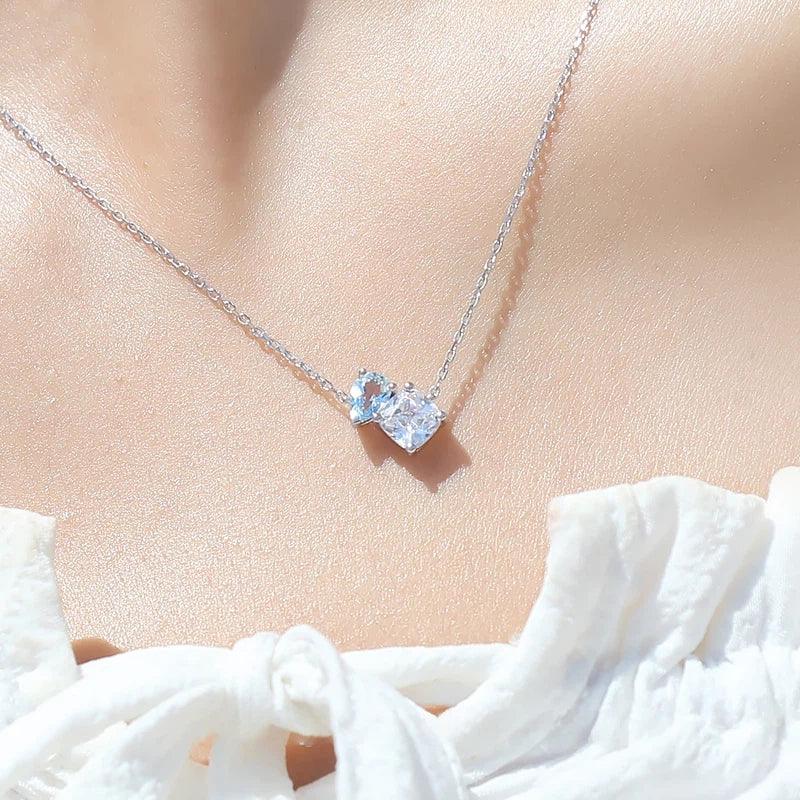 Aquamarine Two-Stone Pendant Necklace worn at the neckline in a close-up