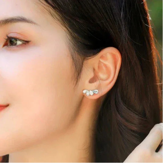 Asymmetric Aquamarine Leaf Drop Earrings worn on the ear from a second angle