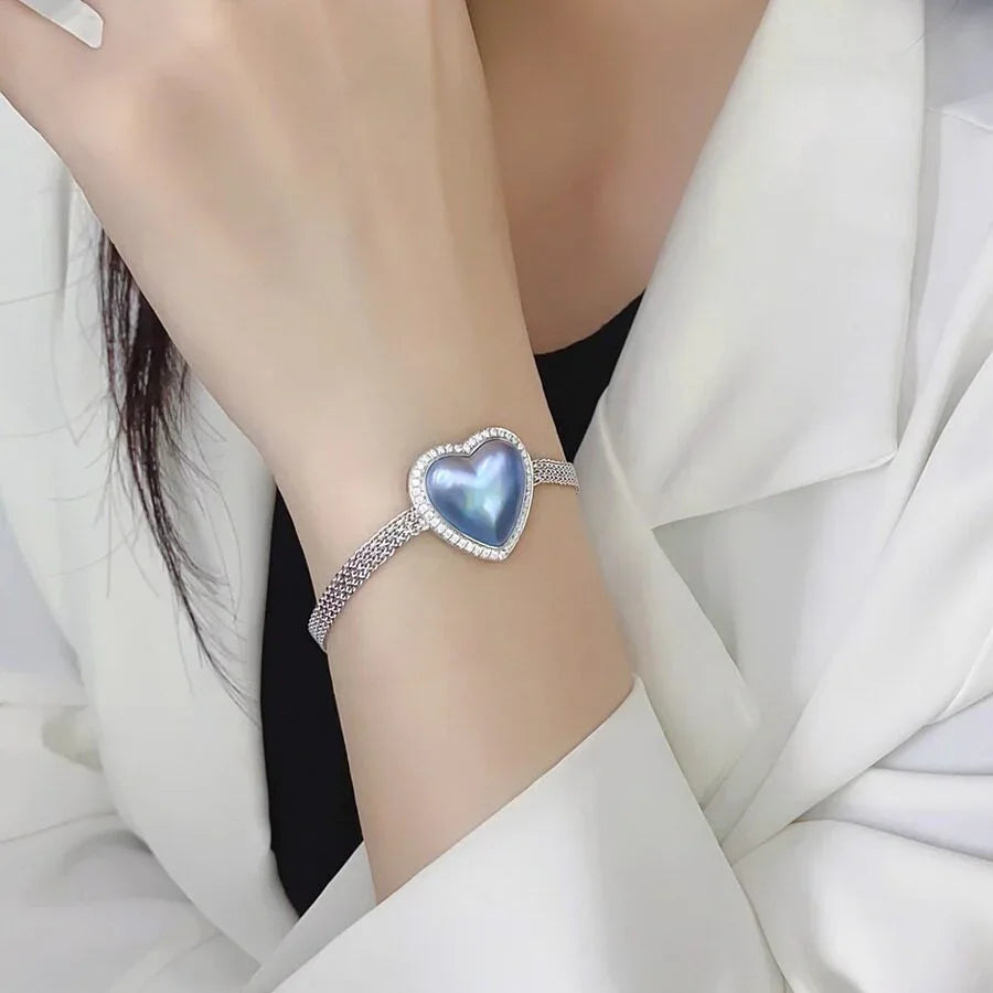 Blue Iridescent Pearl Heart Halo Bracelet — alternate wrist-worn close-up