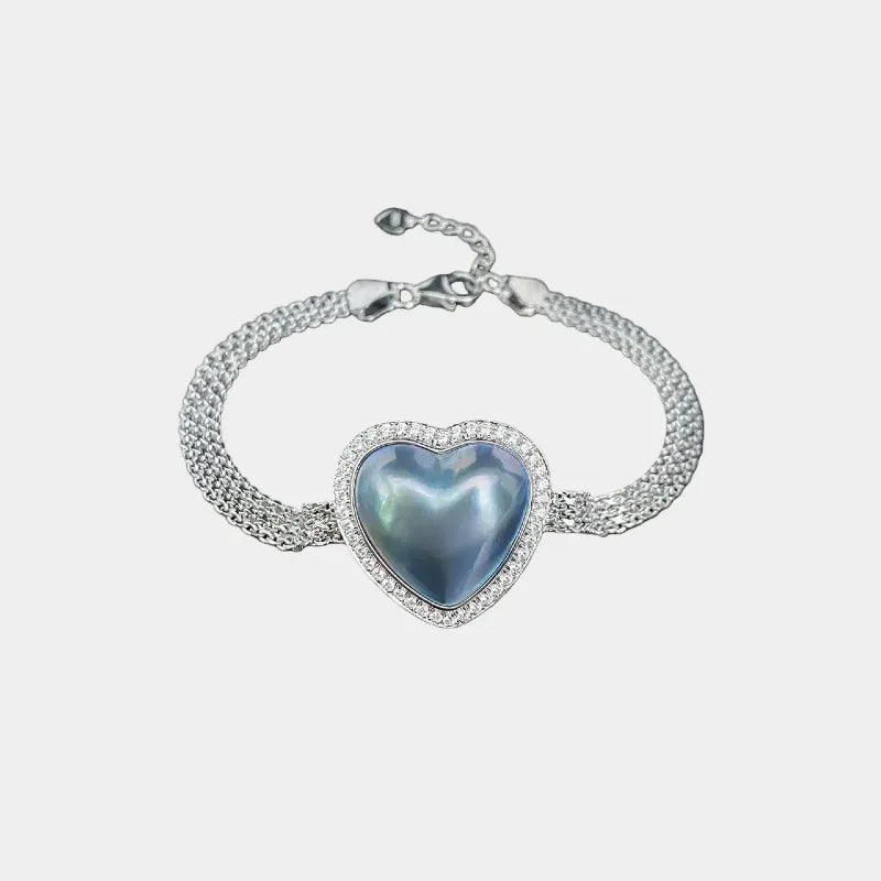 Blue Iridescent Pearl Heart Halo Bracelet — front view of silver mesh bracelet with a large blue iridescent heart