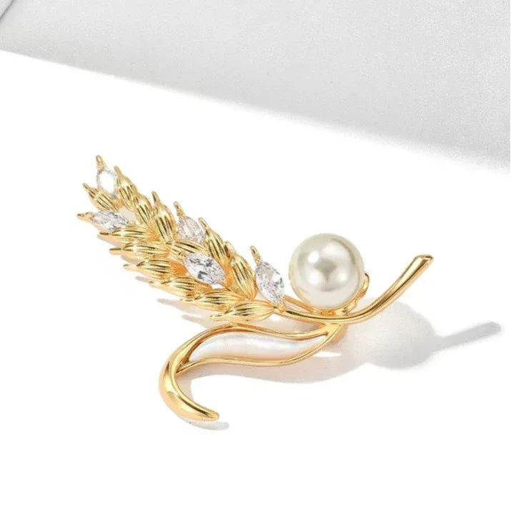Shell Pearl Golden Wheat Brooch — angled product view showing the curved outer stem