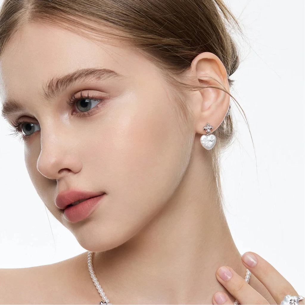Pearl Heart Drop Earrings with Floral Tops — right-ear worn portrait