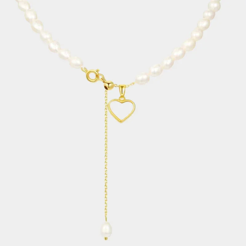 Pearl Toggle Lariat Necklace with Open Heart — isolated close view of the pearl strand, toggle clasp, open heart