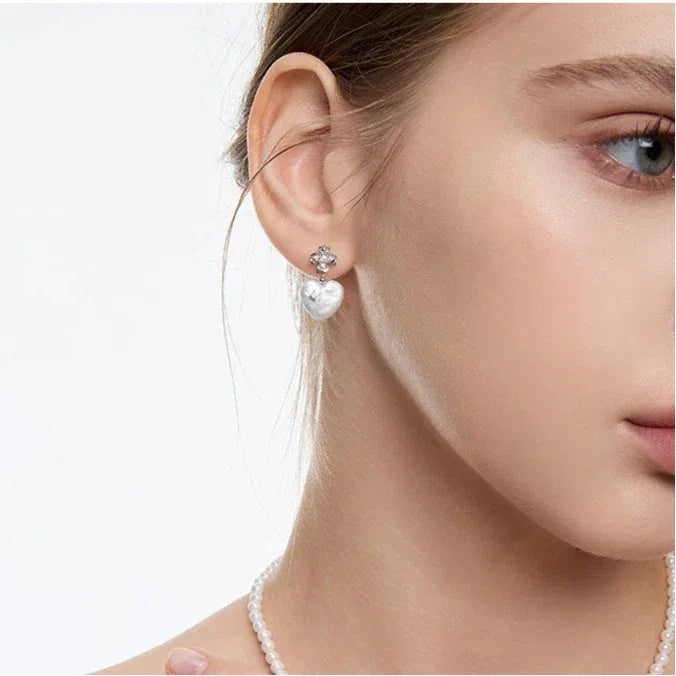 Baroque Pearl Heart Open Ring with Floral Detail — coordinated worn view with matching earrings