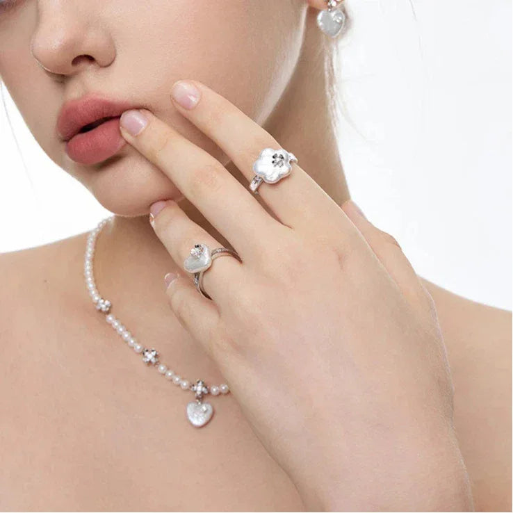 Pearl Heart Necklace with Floral Stations — alternate portrait showing the heart drop at the neckline