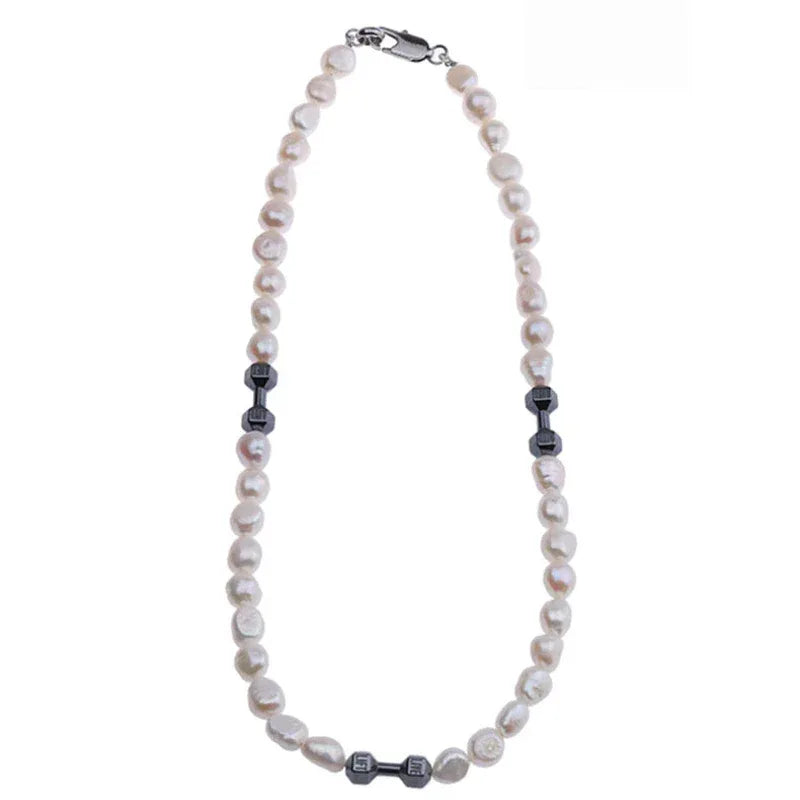 Baroque Pearl Necklace with Black Dumbbell Spacers — vertical product view emphasizing the lower black spacer group