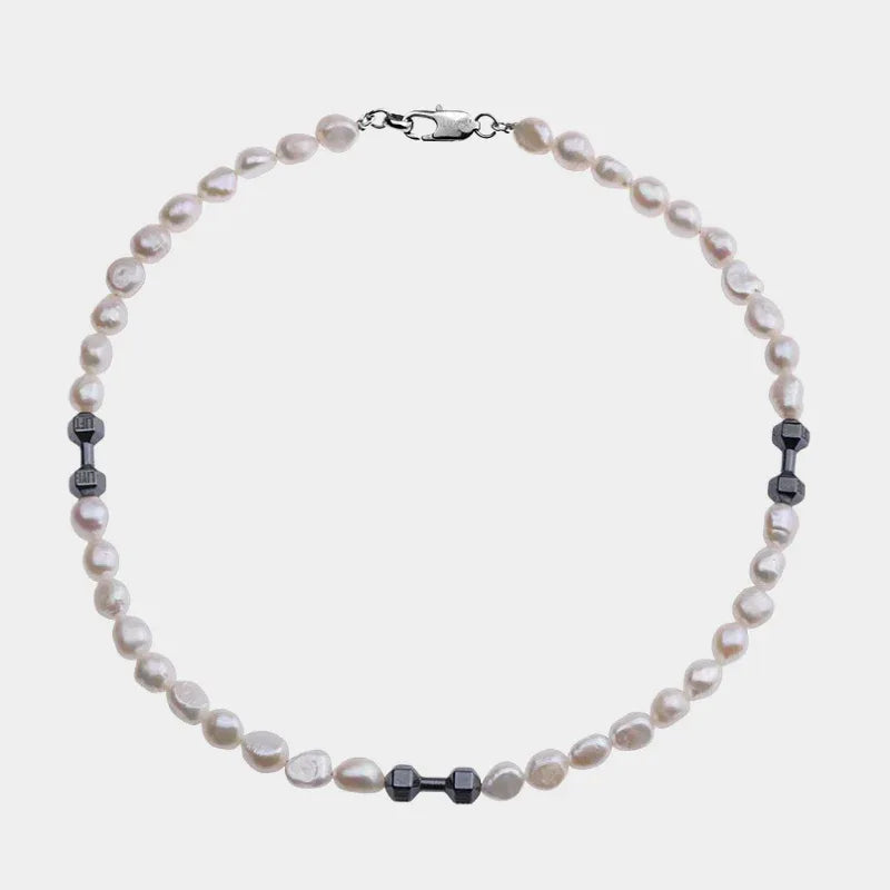 Baroque Pearl Necklace with Black Dumbbell Spacers — front view of pale baroque pearl necklace with grouped black spacers