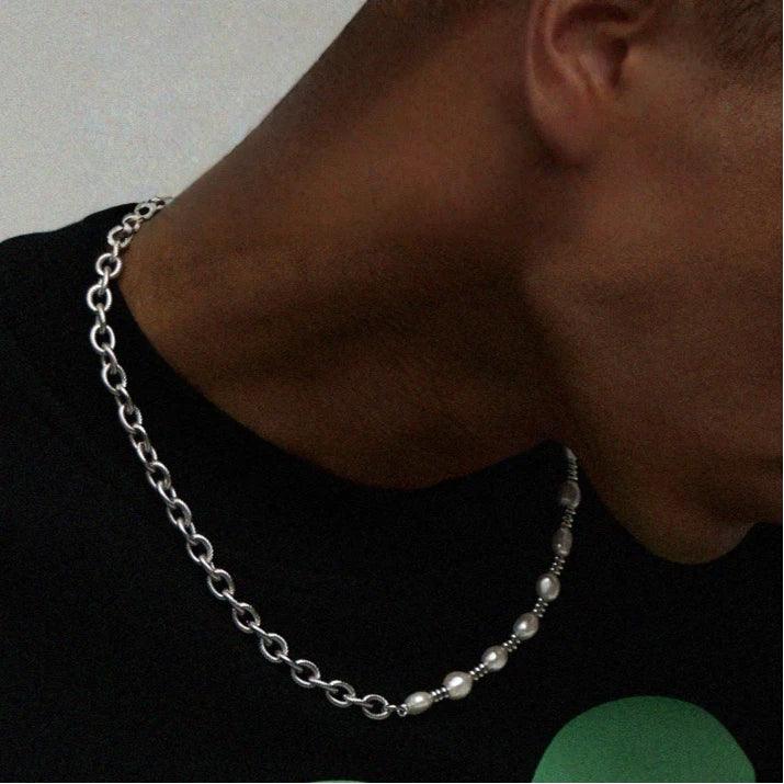 Baroque Pearl and Spiral Chain Half-and-Half Necklace — side-profile worn view over a dark shirt