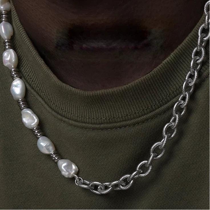 Baroque Pearl and Spiral Chain Half-and-Half Necklace — neckline close-up over an olive ribbed top