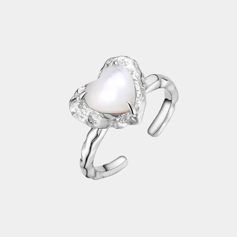 Open Pearl Heart Ring — isolated angled view of the open ring with a pale heart center