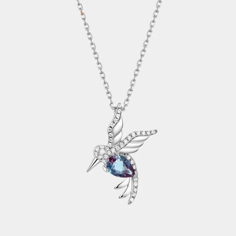 Bird-shaped pendant necklace with a Alexandrite body, full product view on a white background