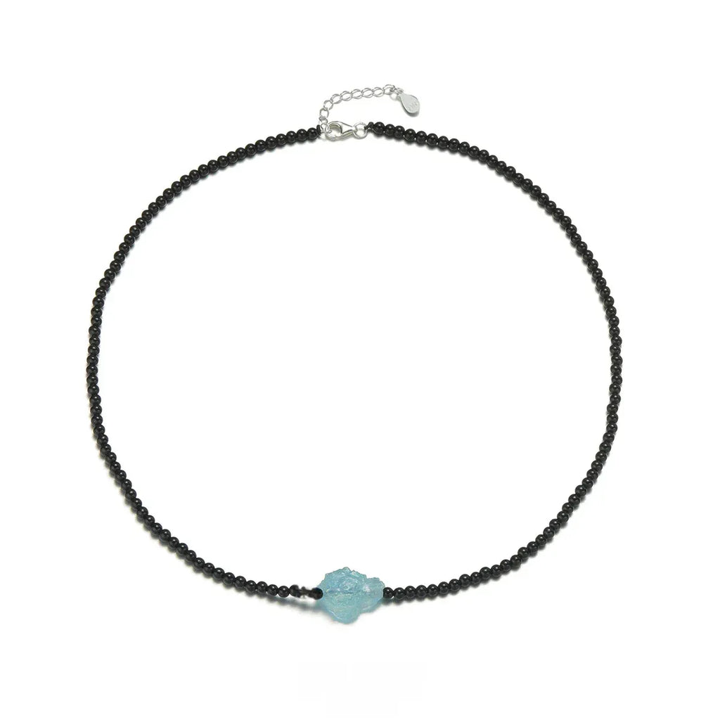 Black Agate and Raw Aquamarine Beaded Necklace angled pendant detail on white