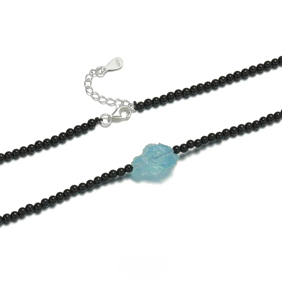 Black Agate and Raw Aquamarine Beaded Necklace pendant and chain detail on a light background