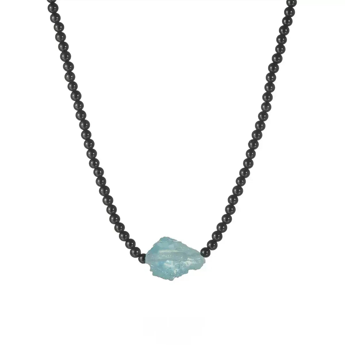 Black Agate and Raw Aquamarine Beaded Necklace styled neckline view showing pendant scale