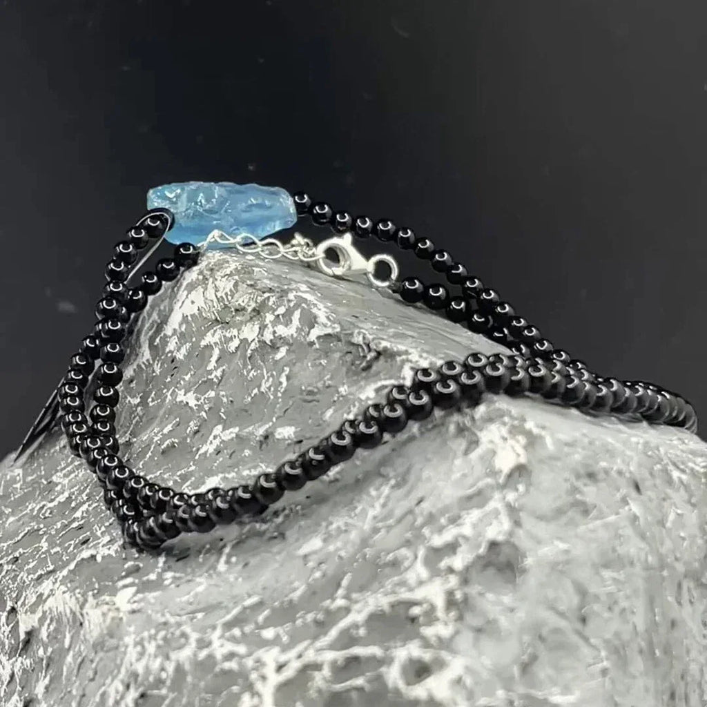 Black Agate and Raw Aquamarine Beaded Necklace worn at the neckline from a second angle