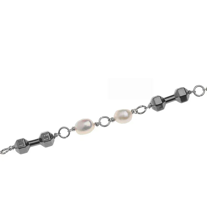 Black Pearl and Obsidian Beaded Bracelet — macro view of the faceted dark beads, pale pearls and connectors