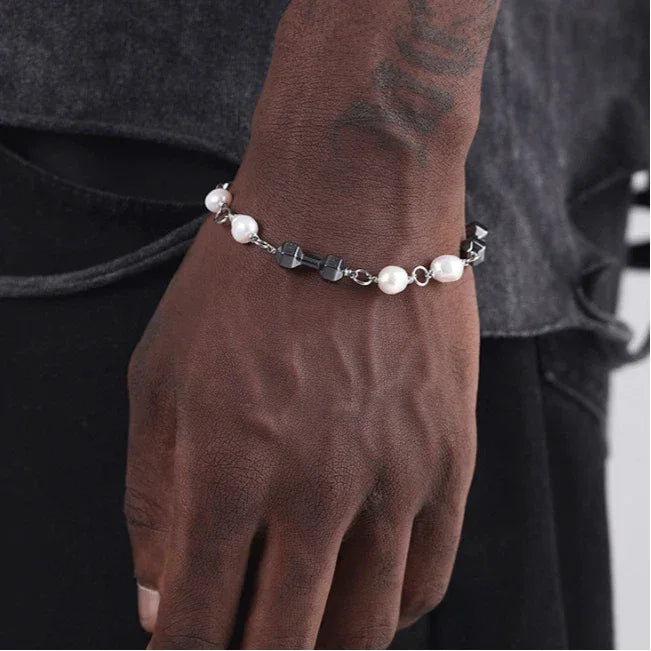 Black Pearl and Obsidian Beaded Bracelet — wrist-worn view over dark trousers