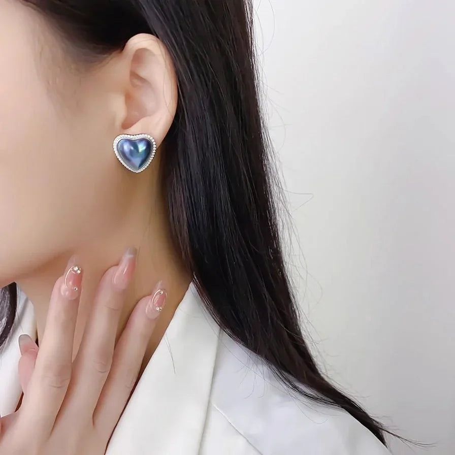 Blue Iridescent Pearl Heart Halo Stud Earrings — alternate left-ear worn portrait