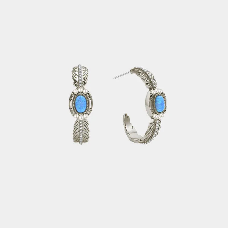 Blue Opal Feather Huggie Hoop Earrings front product view on a light background
