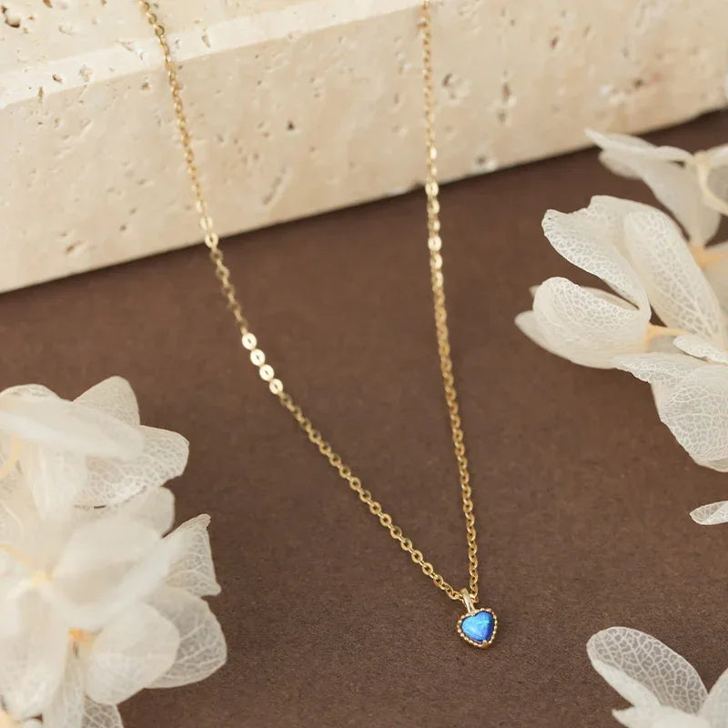 Blue Opal Heart Pendant Necklace worn at the neckline