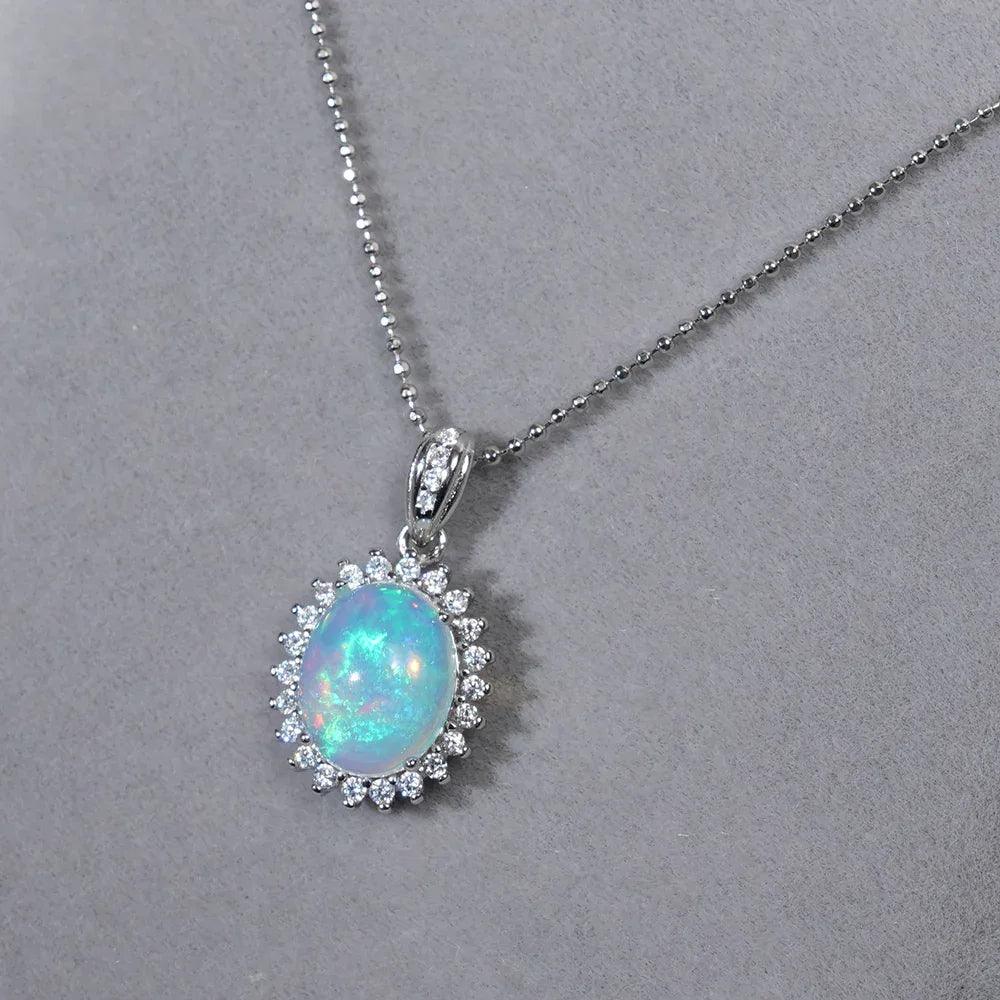 Blue Opal Oval Halo Pendant Necklace pendant and chain on a display