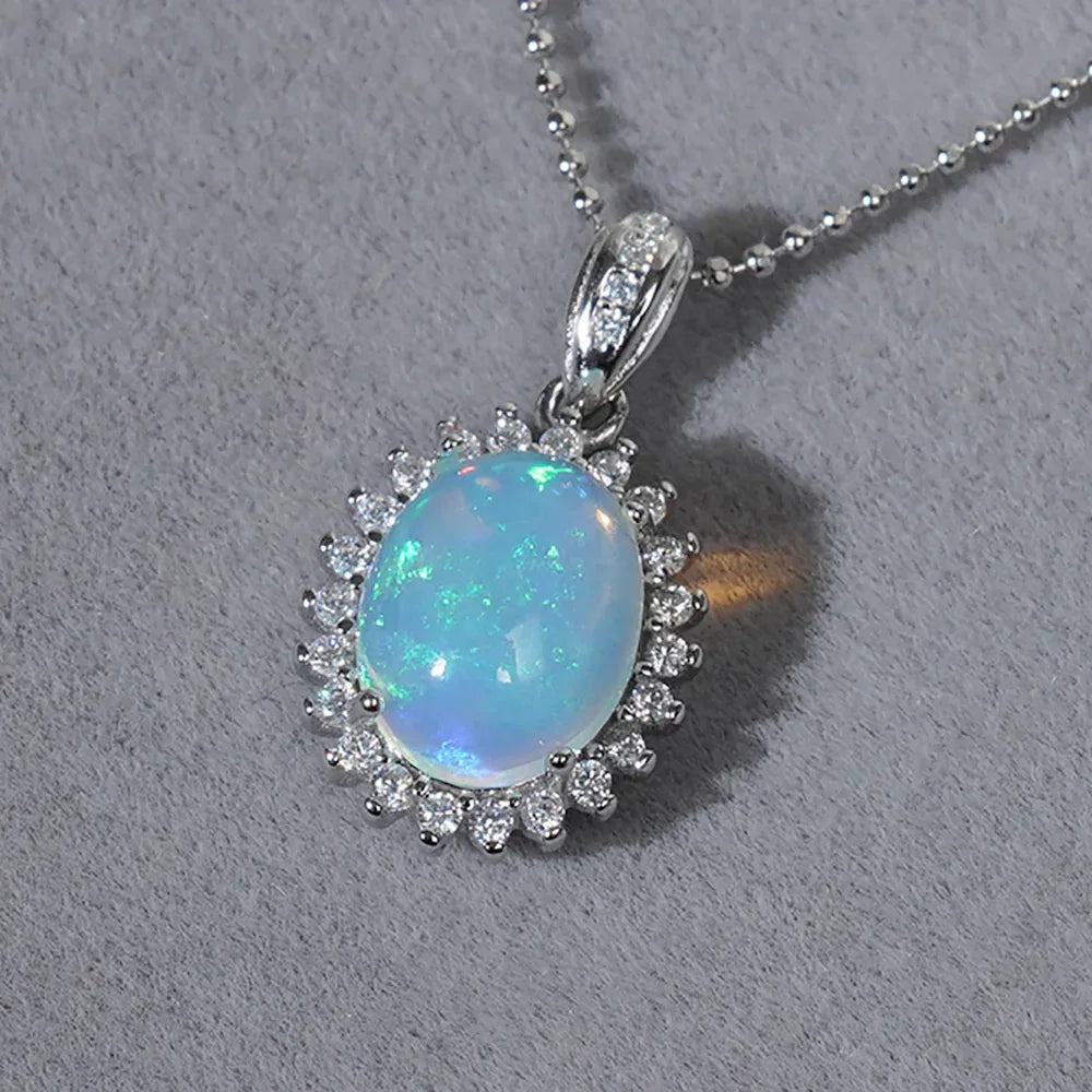 Blue Opal Oval Halo Pendant Necklace worn at the neckline from another angle