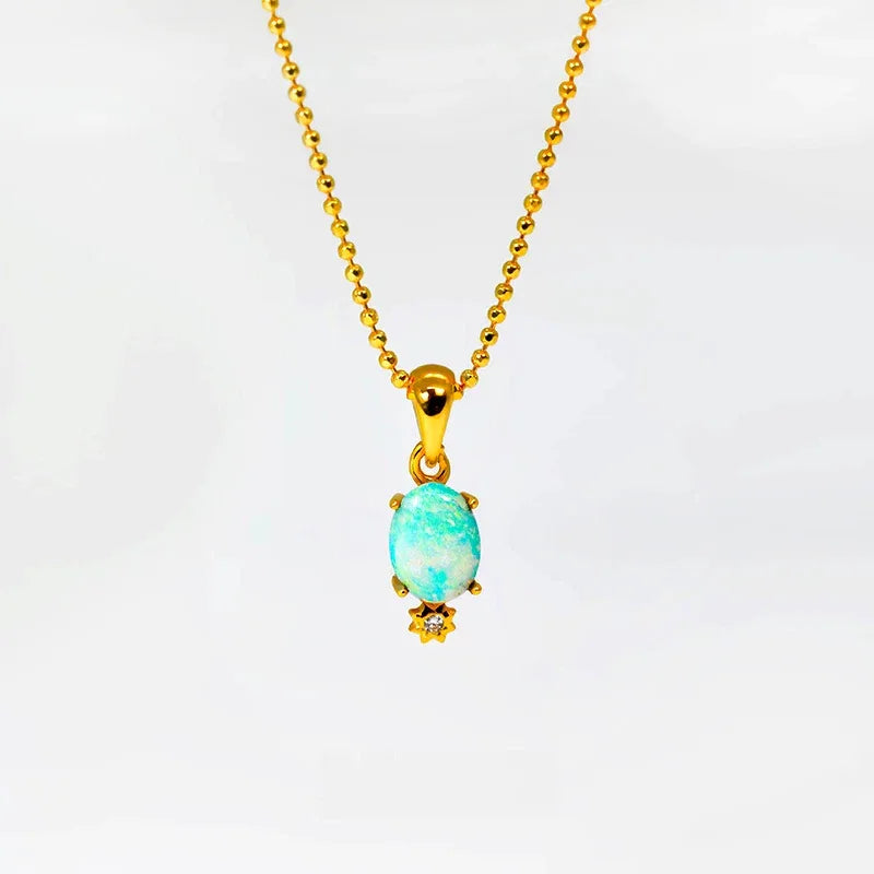 Blue Opal Petite Pendant Necklace pendant and chain on a display