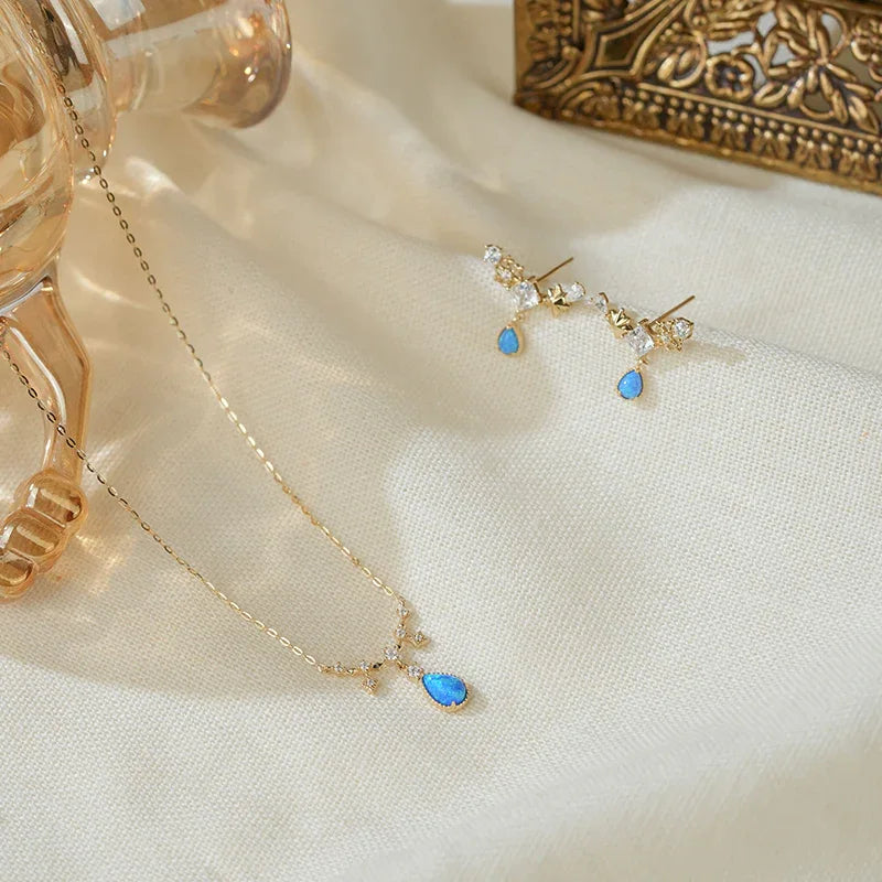 Blue Opal Teardrop Station Necklace worn at the neckline