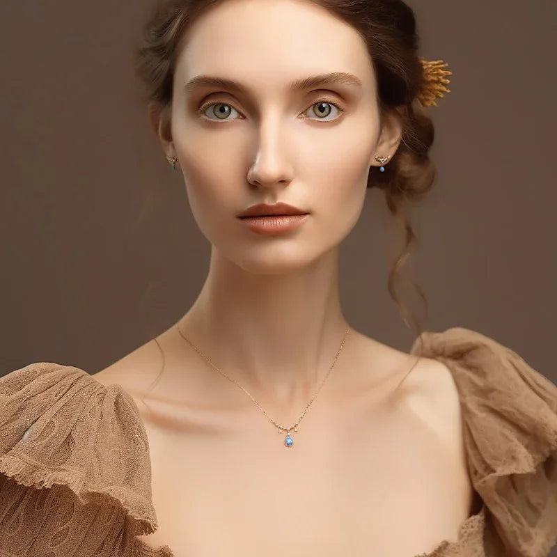 Blue Opal Teardrop Station Necklace worn at the neckline from another angle