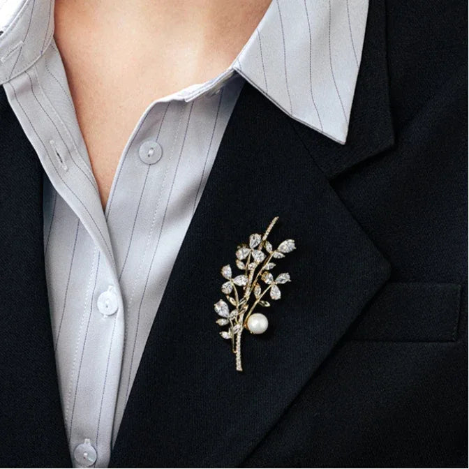 Shell Pearl Leafy Branch Brooch — close blazer-worn view showing scale