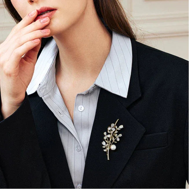 Shell Pearl Leafy Branch Brooch — model portrait with the brooch pinned on a dark blazer