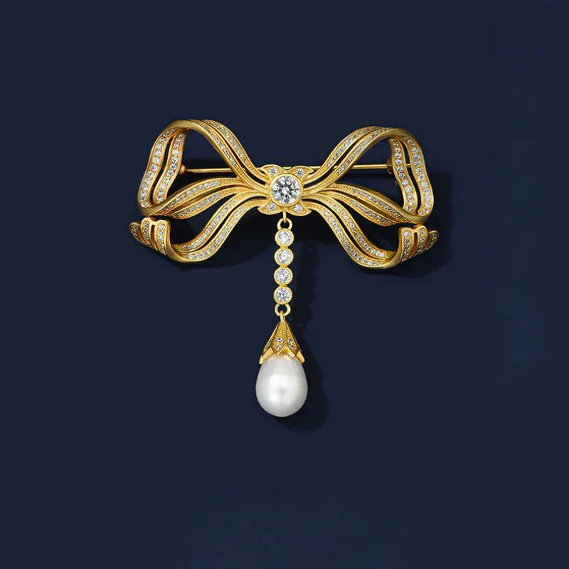 Pearl Bow Tassel Brooch — front product view on a dark background