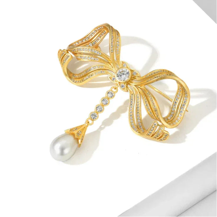 Pearl Bow Tassel Brooch — angled product view showing the dimensional ribbon loops