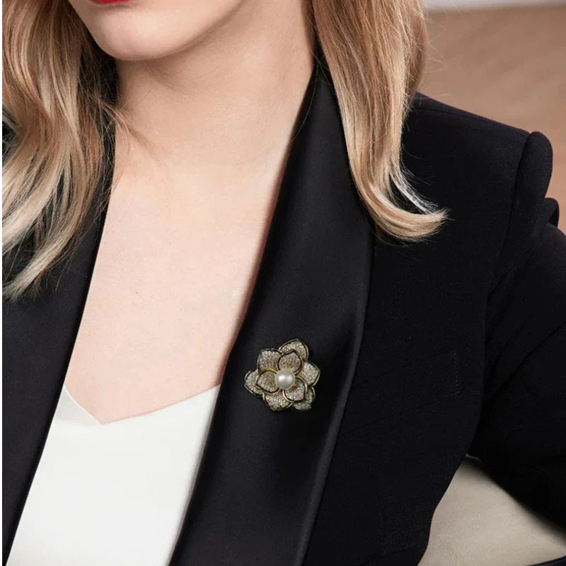 Shell Pearl Camellia Brooch — close blazer-worn view showing design and scale