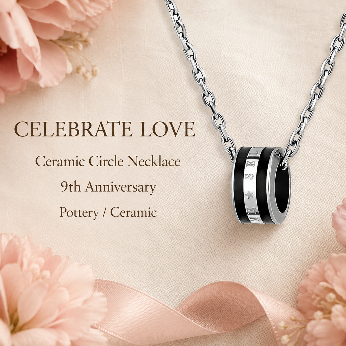 Black and silver ceramic circle necklace arranged on ivory fabric with ninth anniversary gift styling