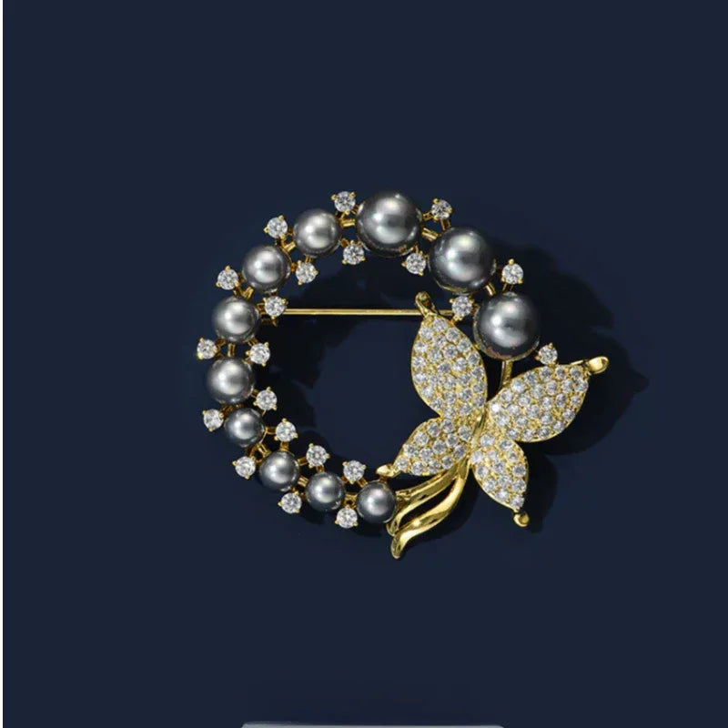 Dark Pearl Butterfly Wreath Brooch — rear product view on a dark background showing the pin fitting