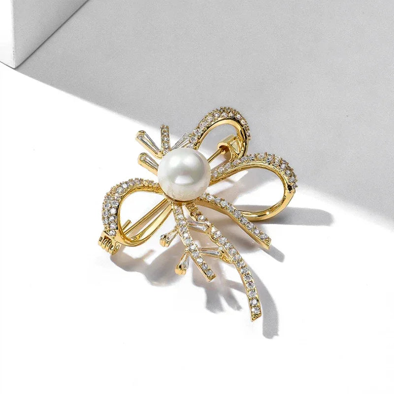 Shell Pearl Bow Brooch — alternate angled close-up showing the ribbon tails