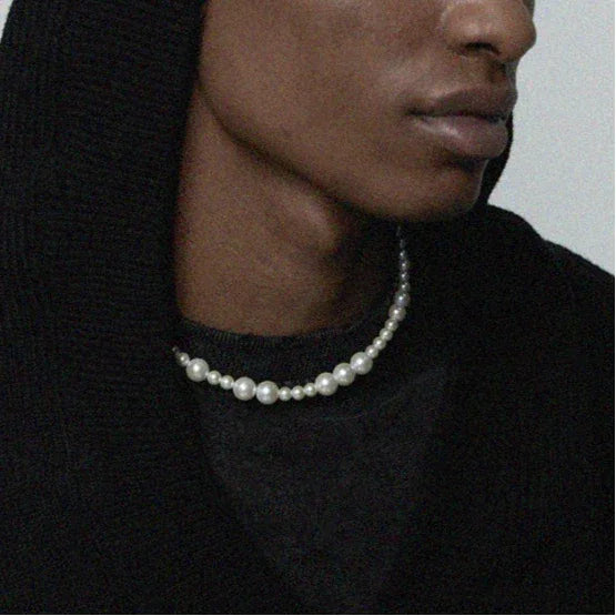 Adjustable Graduated Pearl Strand Necklace — portrait neckline-worn view over a black top
