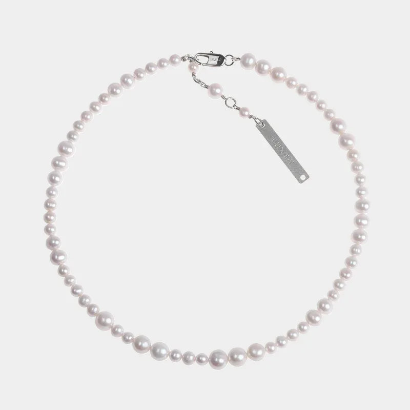 Adjustable Graduated Pearl Strand Necklace — front view of graduated pearl necklace with extension chain