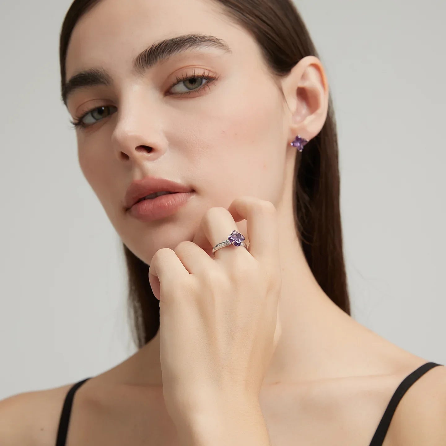 clover-cut amethyst ring styled portrait showing the ring for scale