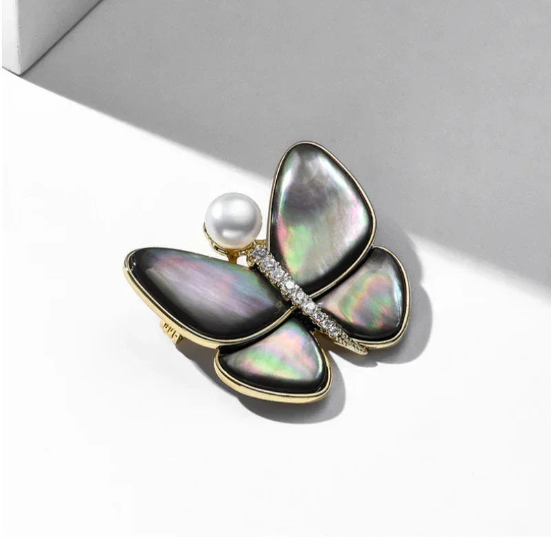 Iridescent Shell Butterfly Brooch with Shell Pearl — alternate angled close-up showing the iridescent wing colors