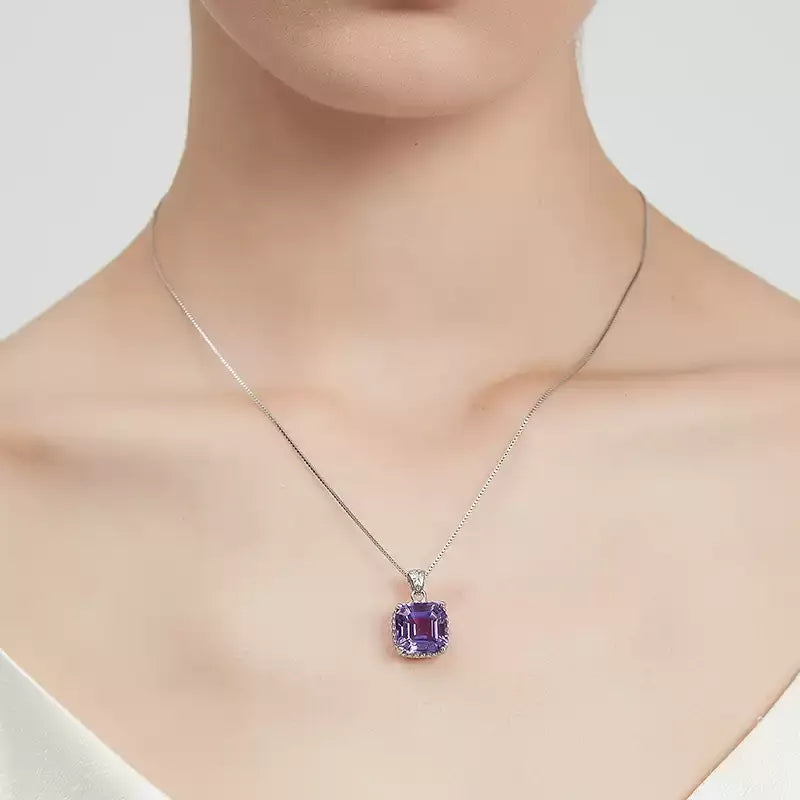 cushion-cut amethyst pendant necklace worn at the neckline in a close-up