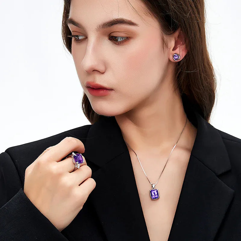 cushion-cut amethyst pendant necklace worn at the neckline in a close-up