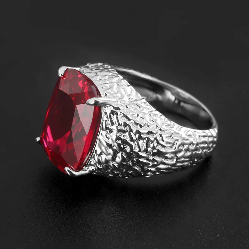 Cushion-Cut Ruby Textured Men's Ring with Wide Band — close-up of ruby setting