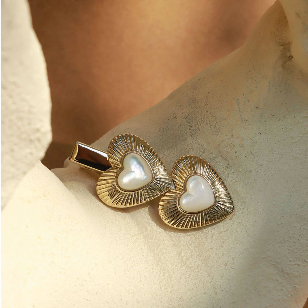 Double Pearl Heart Hair Clip — clip displayed on a pale textured surface