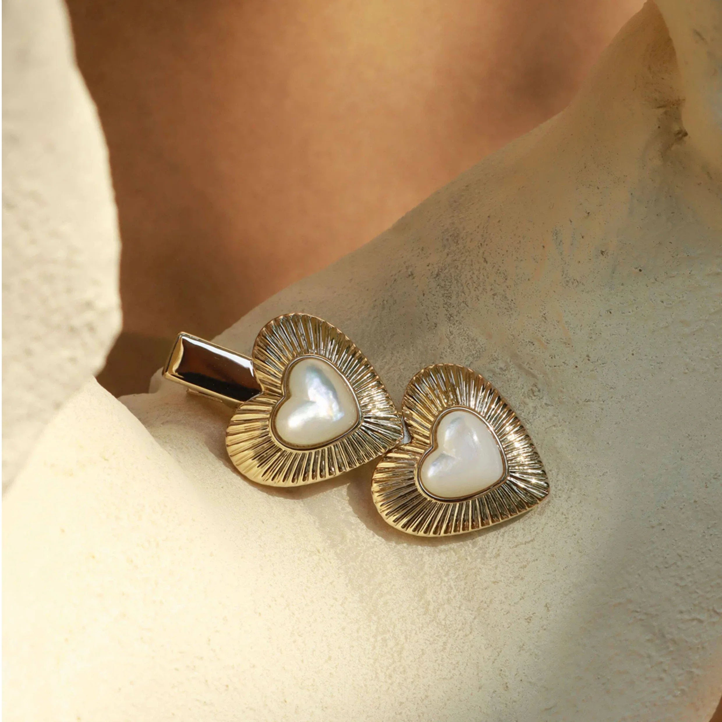 Double Pearl Heart Hair Clip — clip displayed on a pale textured surface