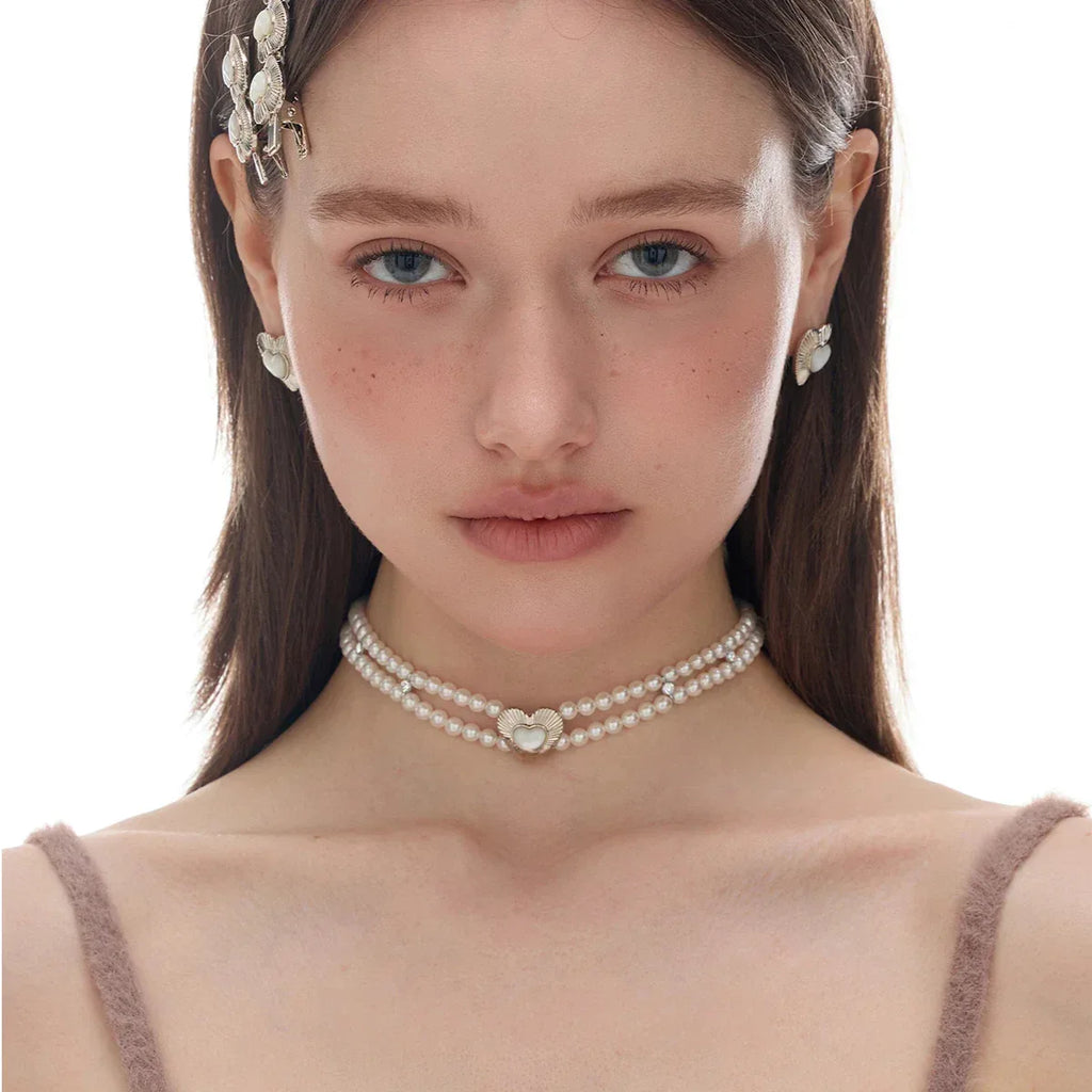 Double-Strand Pearl Heart Choker — front model portrait showing the close collar fit