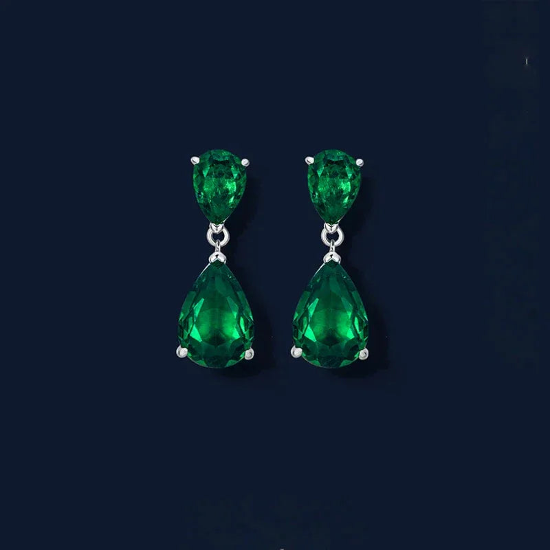 Double Pear-Cut Emerald Drop Earrings paired product view on a dark background