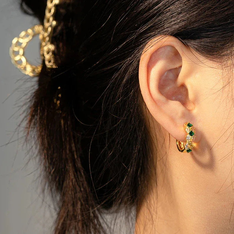 Emerald and Marquise Huggie Hoop Earrings styled ear view showing scale