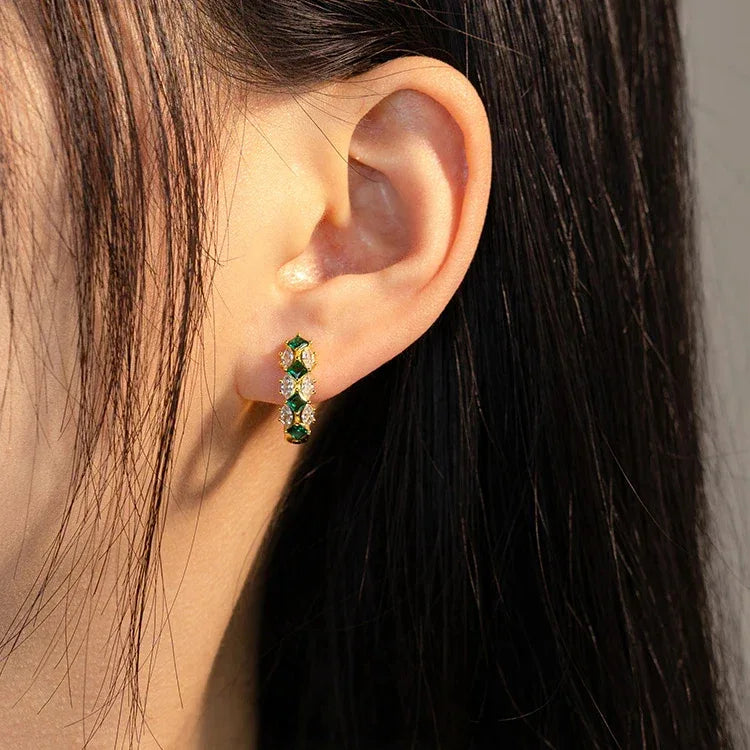 Emerald and Marquise Huggie Hoop Earrings worn on the ear from a second angle